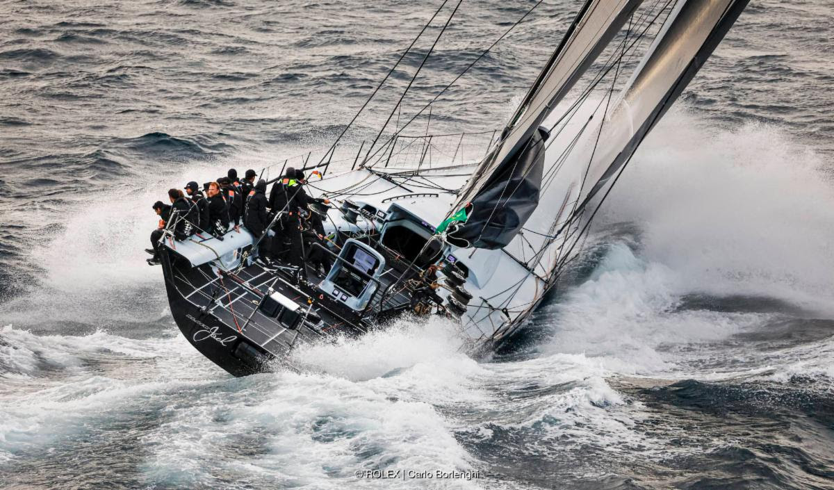 Black Jack 100 powers round the 695-mile course from Cowes to Cherbourg-en-Cotentin via the Fastnet Rock © ROLEX/Carlo Borlenghi
